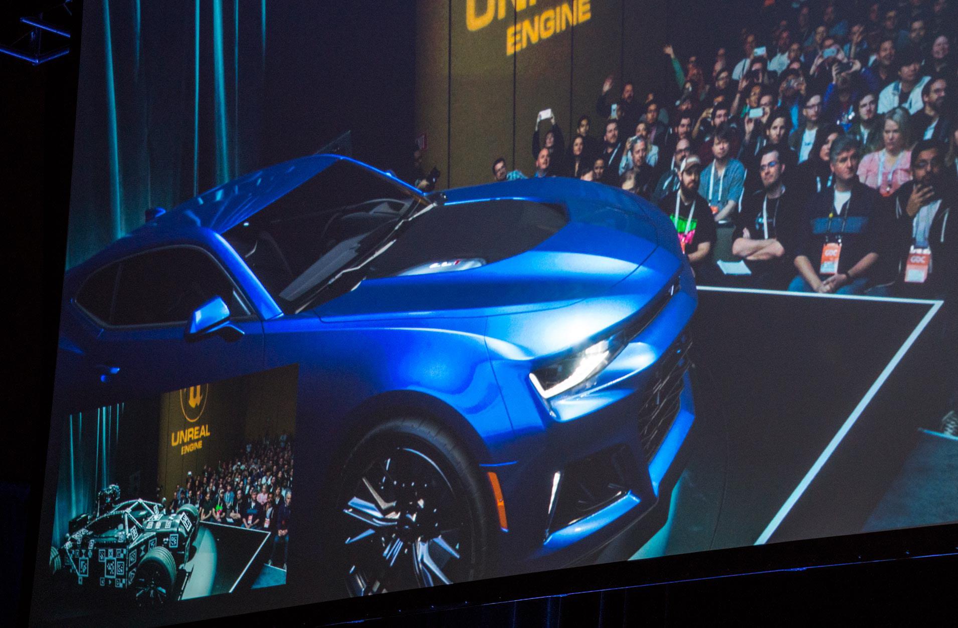 The view from Cyclops: The Mill’s Cyclops camera shows the Blackbird frame (corner window) dressed in a lovely blue Camaro with reflections from audience and stage cast on the car’s body. Chevrolet’s Marketing Director Sam Russell said, a car is like a big mirror. (Source: JPR)