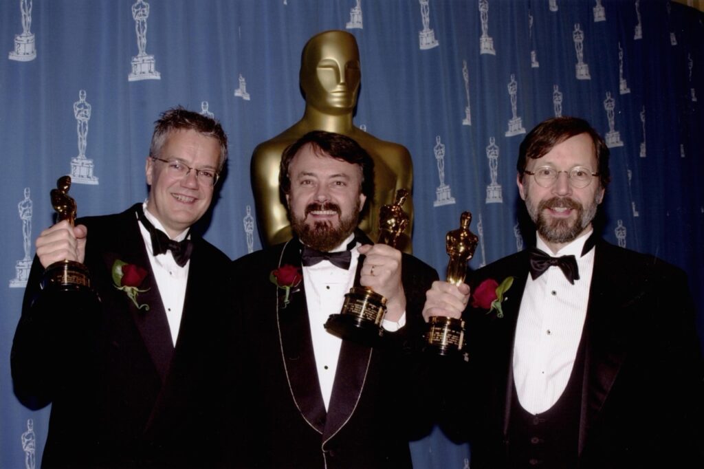 (Left to right) Rob Cook, Loren Carpenter, and Ed Catmull receiving their Academy Award of Merit.